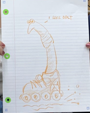 [a drawing made by a workshop participant of a worm saying: I like dirt]