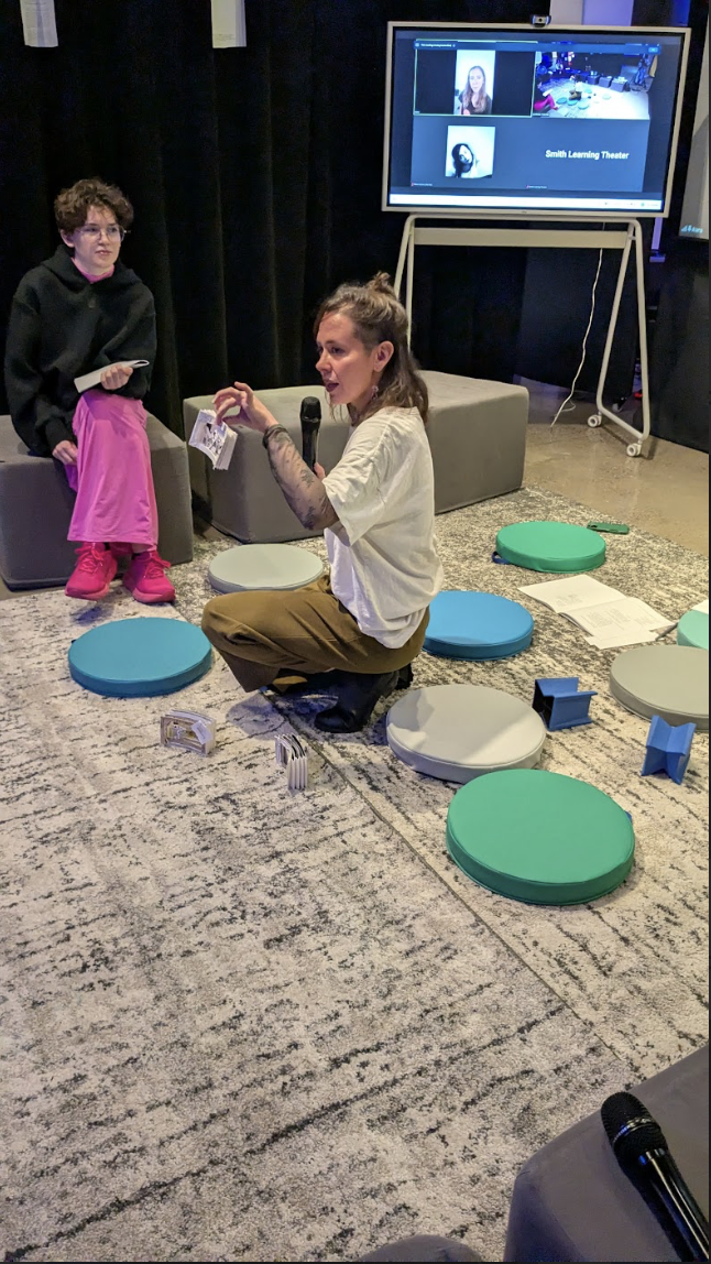 [a photo of Maria holding a small scene sketch from Scene 2: Escape from the Psych Ward.]